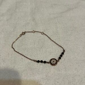 Fashion bracelet rose gold with mati/evil eye and black beads